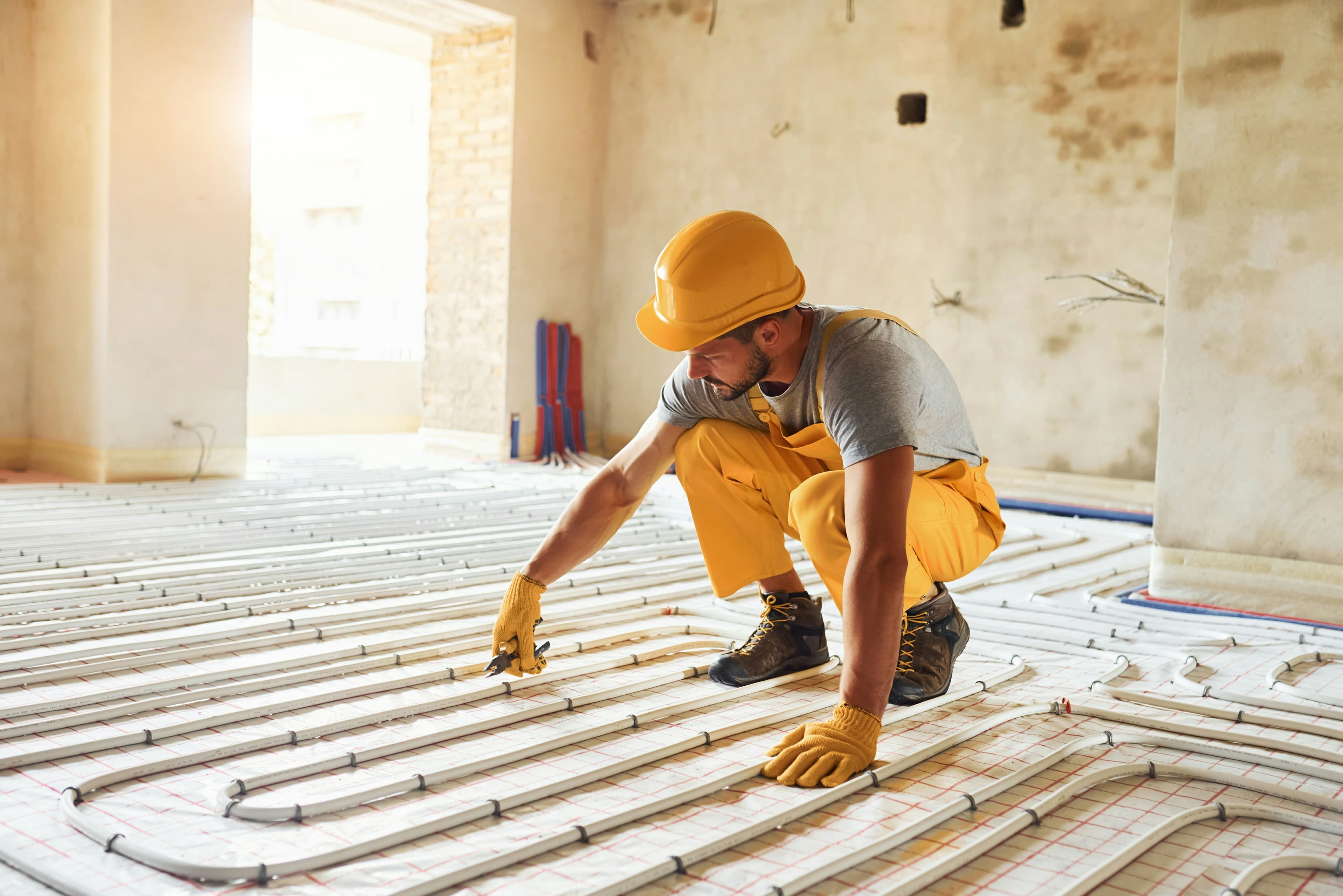 A man in a hard hat on a job site