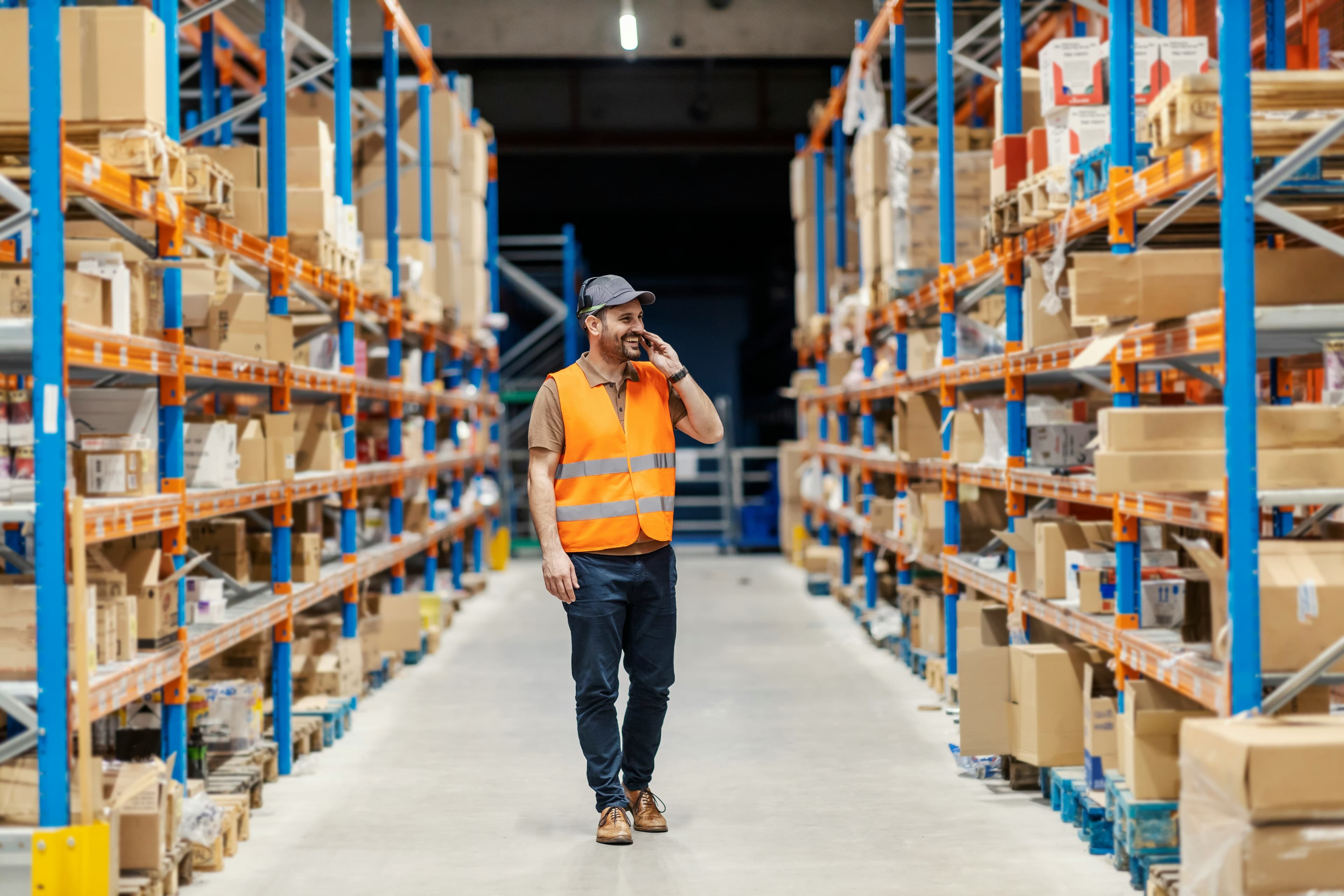 A person on the phone in a warehouse