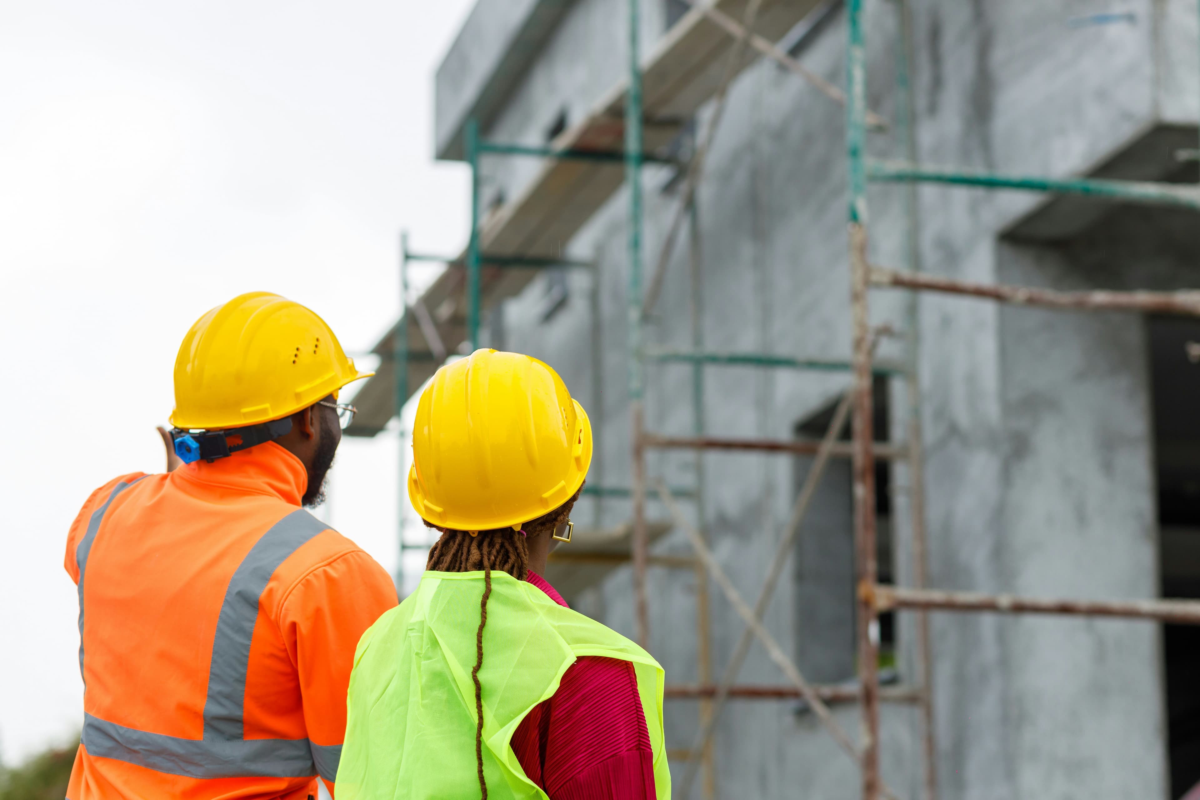 Two people at a construction job site